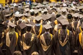 A group of graduates in caps and gowns.